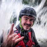 Man in Red and Black Jacket Wearing Black Helmet